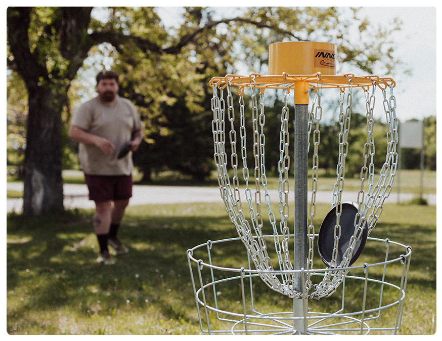 Play a round of disc golf with your peers