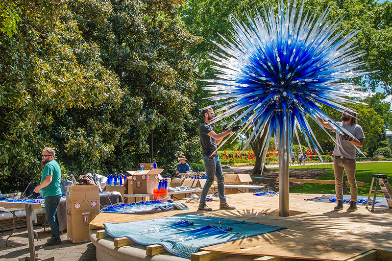 Installing a glass sculpture for the exhibition
